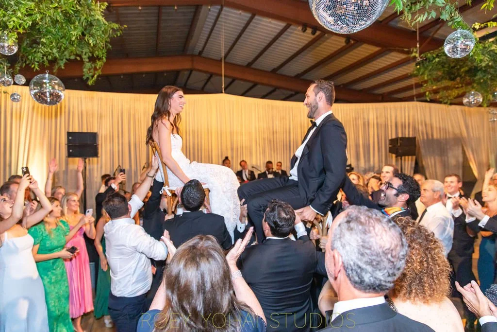  Bride and groom were hoisted high up in their chairs during the hora 