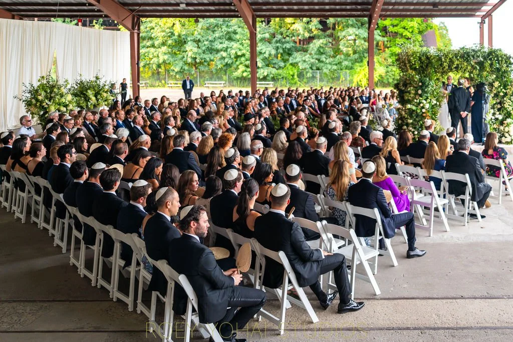  Some of the 300 people attending the wedding —&nbsp;seated. 