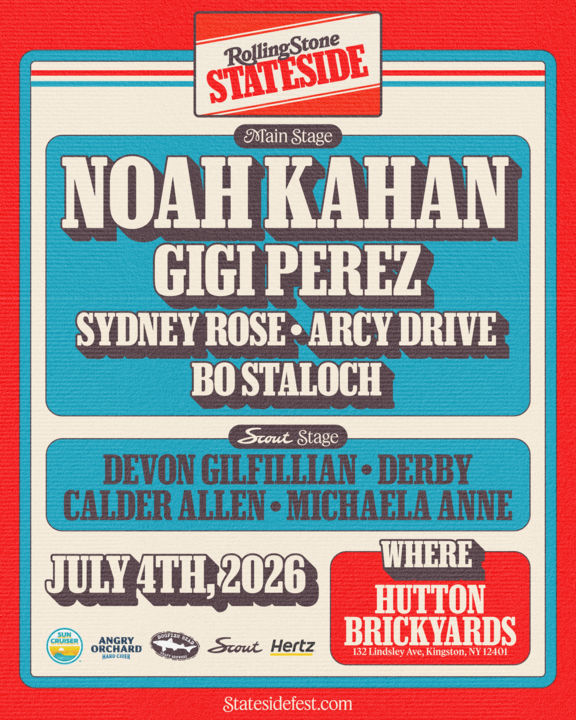 a bride and groom walking along the Hudson River during their big day