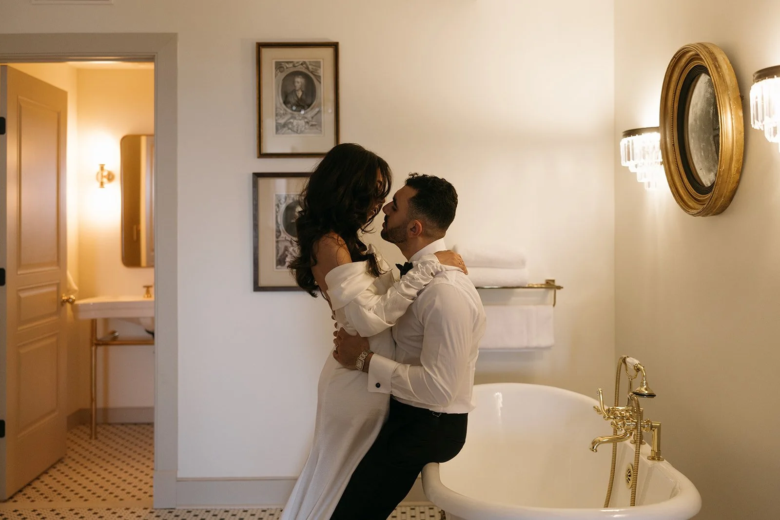 drink toast in front of an elegant chandelier