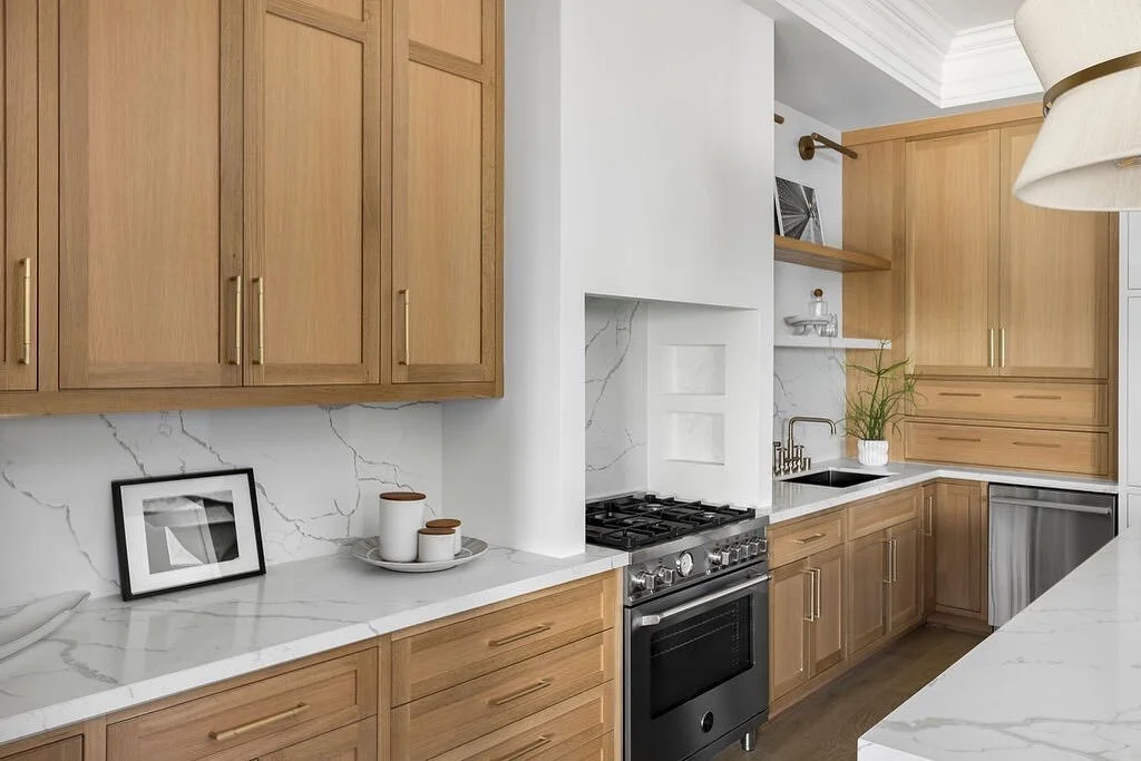 Rift sawn white oak cabinets standing a little over 10&rsquo; tall. The stone floating shelf to cap the backsplash is an incredible touch especially with under lighting from the oak floating shelf above. 

@see.arch architecture
@foreverhomepropertie