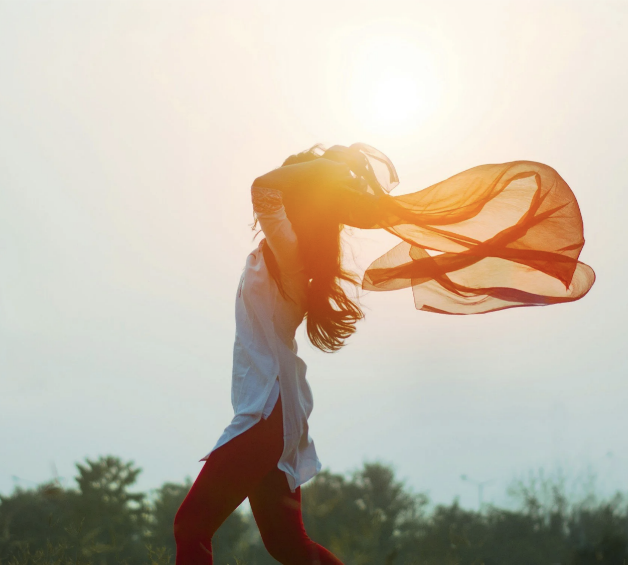 Woman walking freely in the sunlight