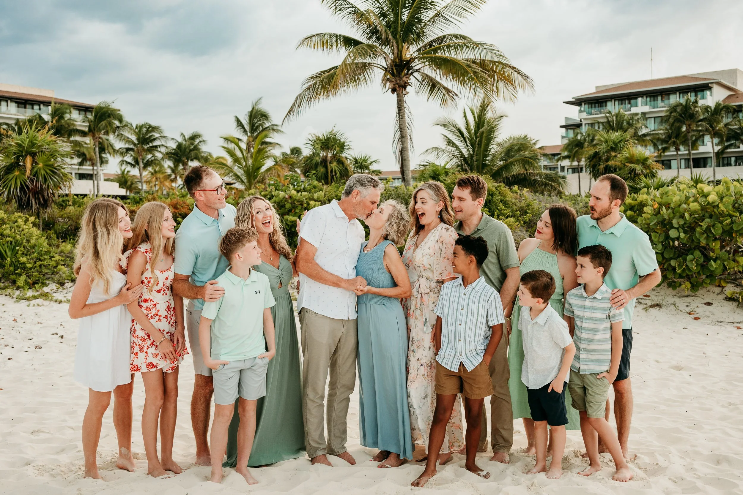 dreams-playa-mujeres-cancun-family-photography-group-laughing.jpg