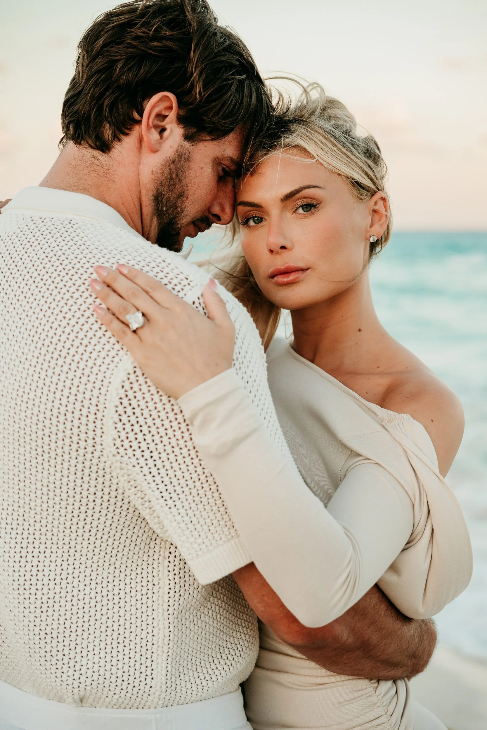 cancun-photography-couple-hug-beach-backdrop.jpg
