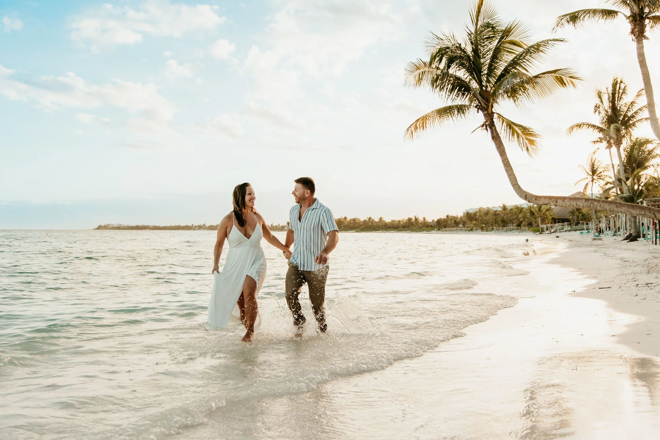 riviera-maya-engagement-photography-couple-running-on-beach.jpg