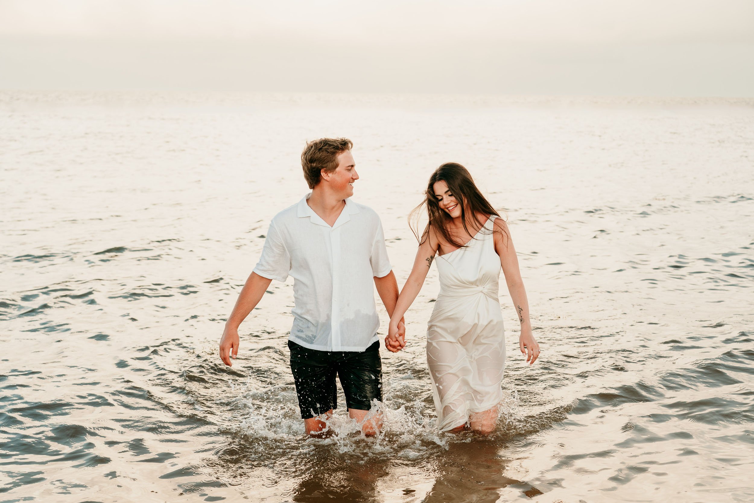 royalton-splash-riviera-cancun-photographer-couple-running-through-water.jpg
