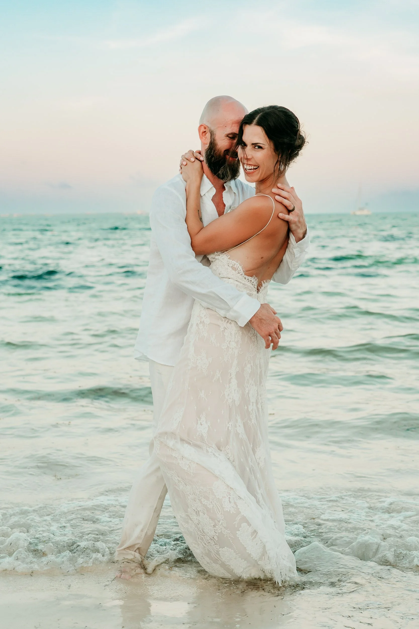 cancun-wedding-photographer-couple-laughing-and-hugging.jpg