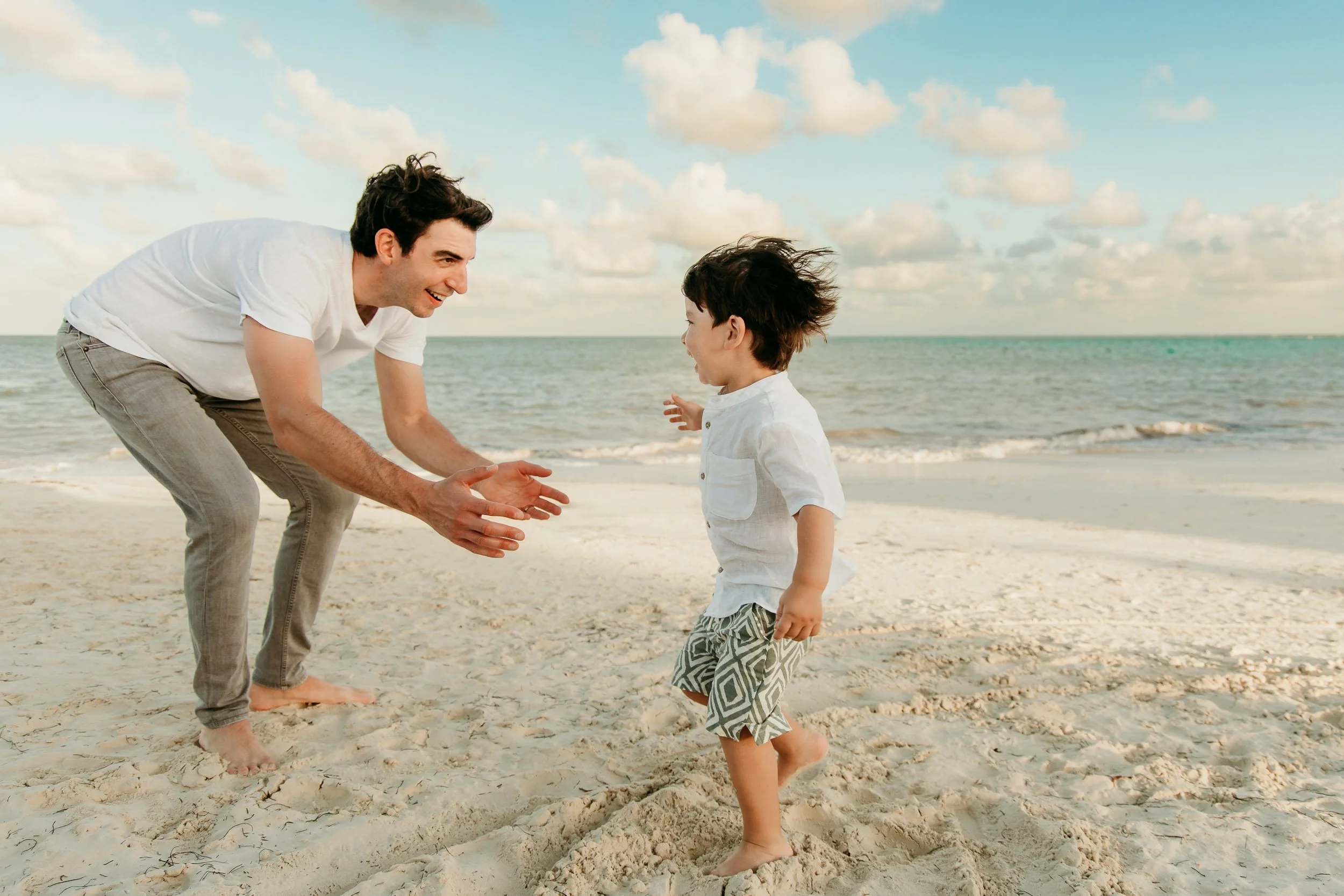 mayakoba-riviera-maya-photographer-son-running-to-dad.jpg