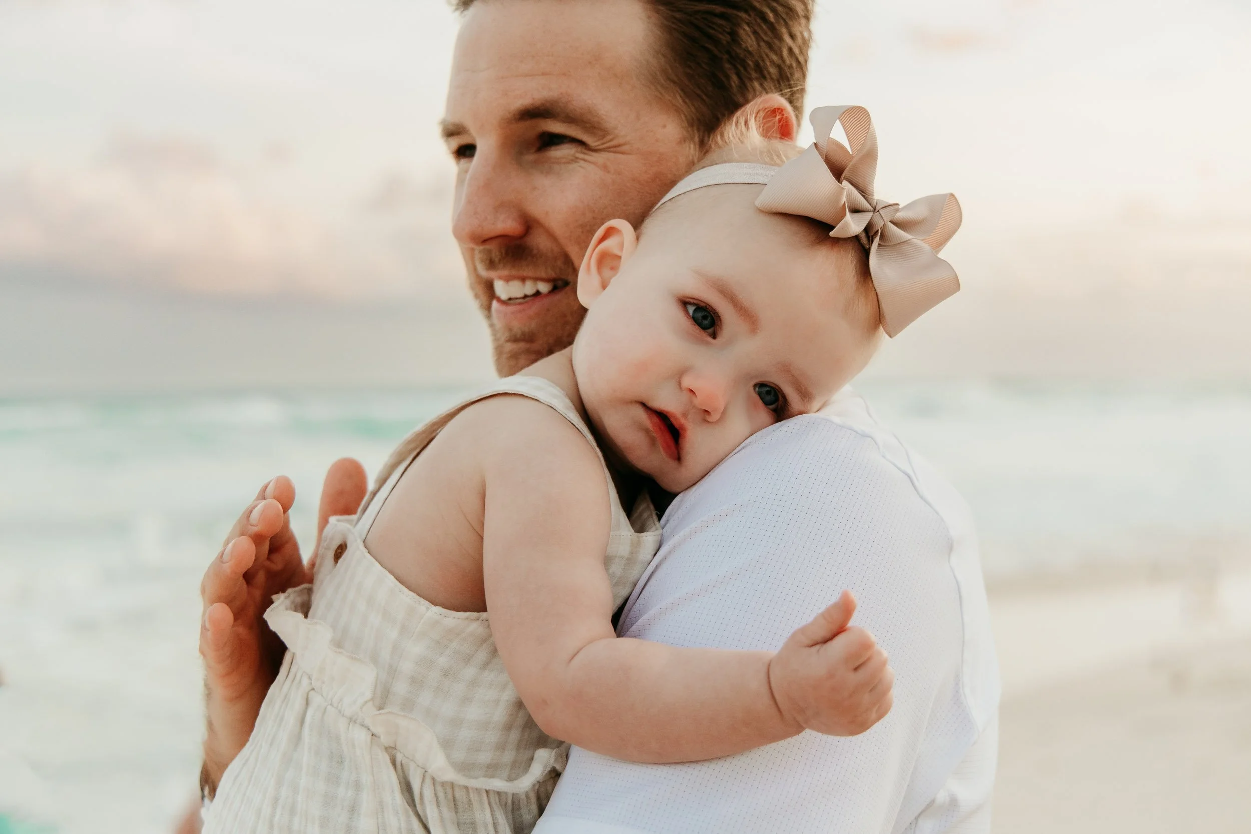 cancun-family-photographer-dad-holding-baby.jpg