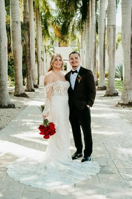 Couple posing for a portrait during their Dreams Tulum wedding.