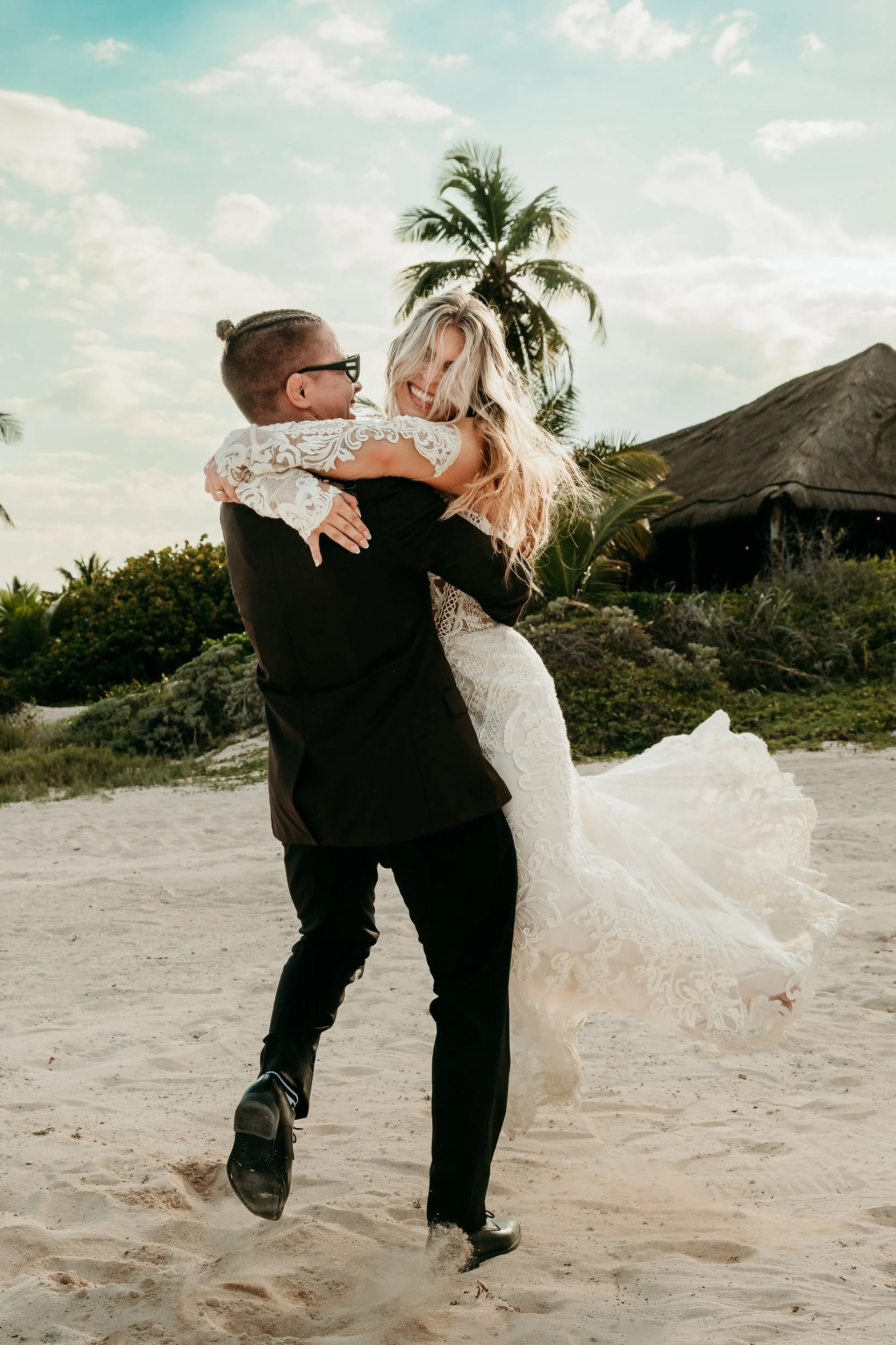dreams-tulum-wedding-photography-groom-spinning-bride.jpg