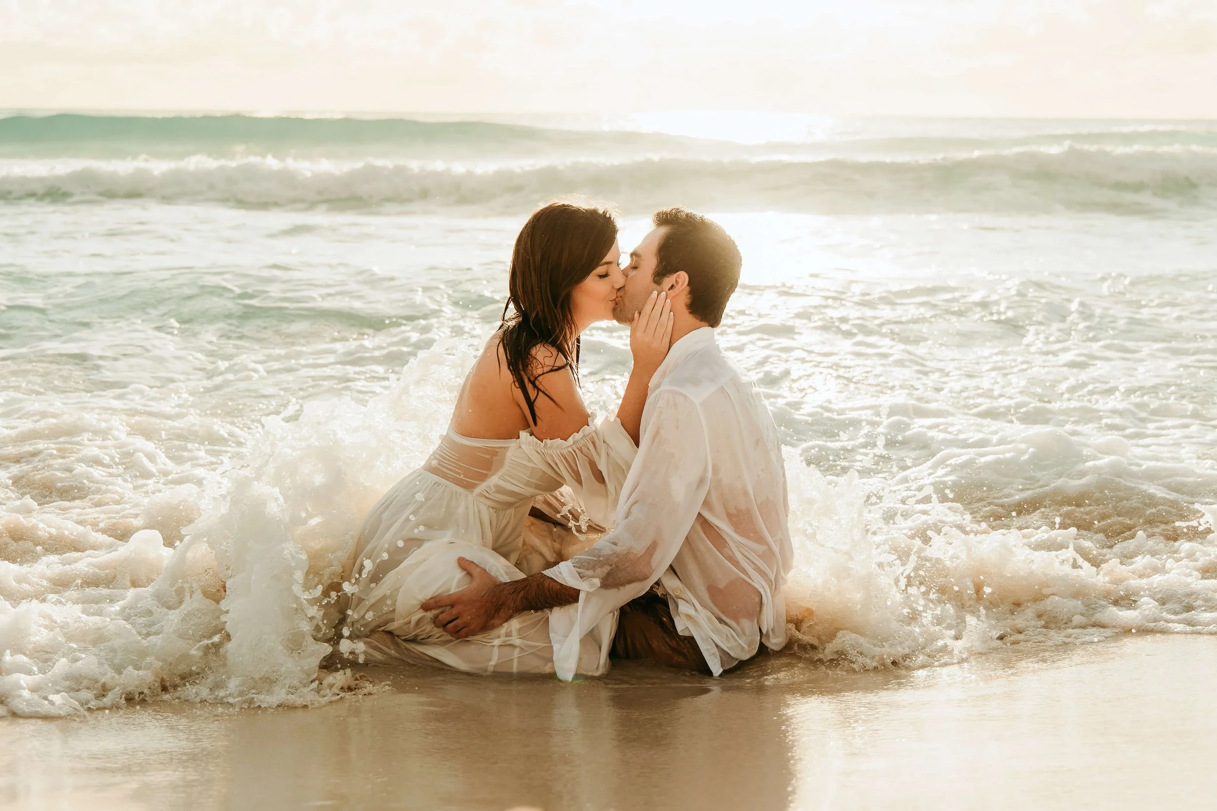 cancun-wedding-photographer-couple-kissing-in-ocean.jpg