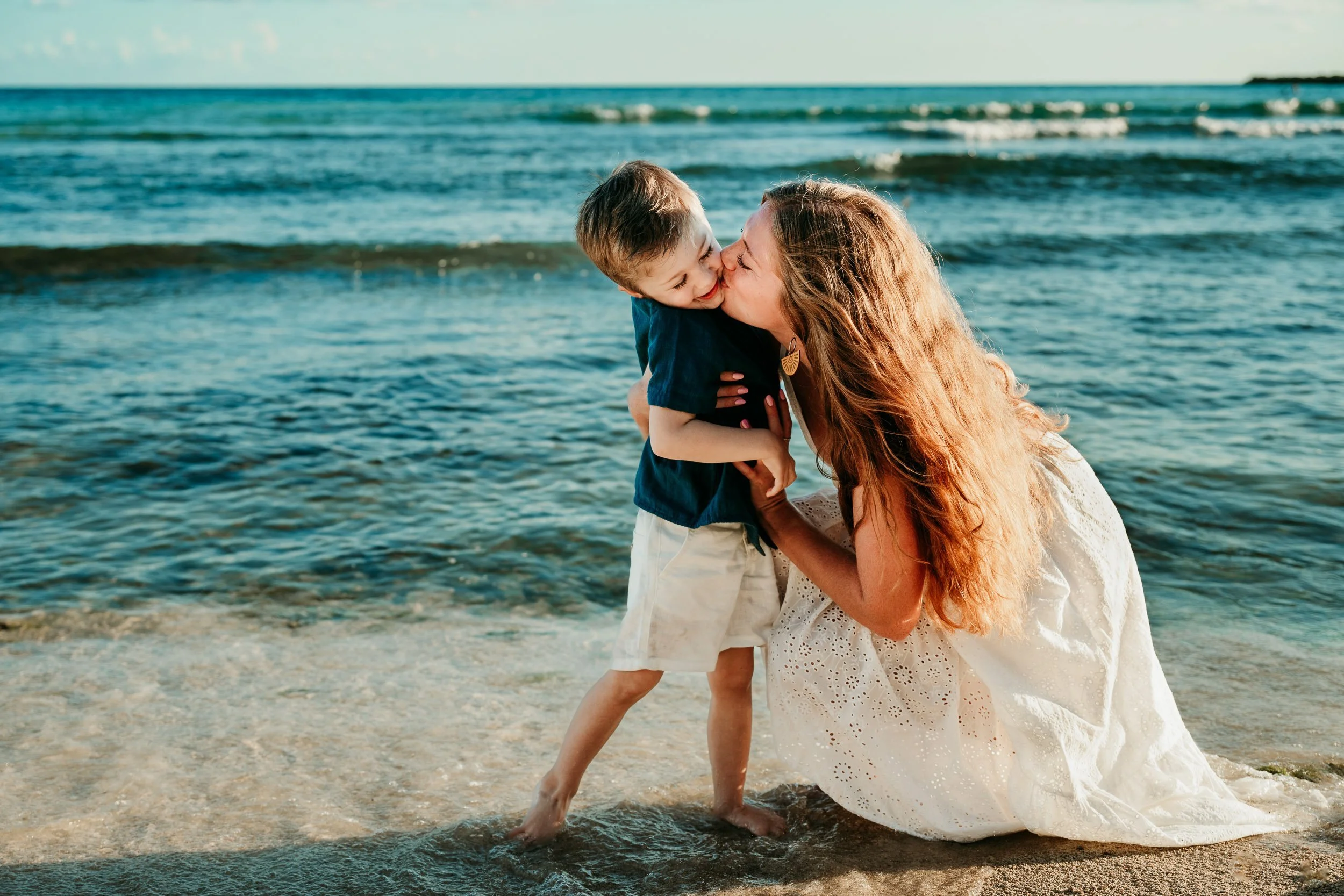 puerto-aventuras-riviera-maya-family-photographer-mom-hugs-son.jpg