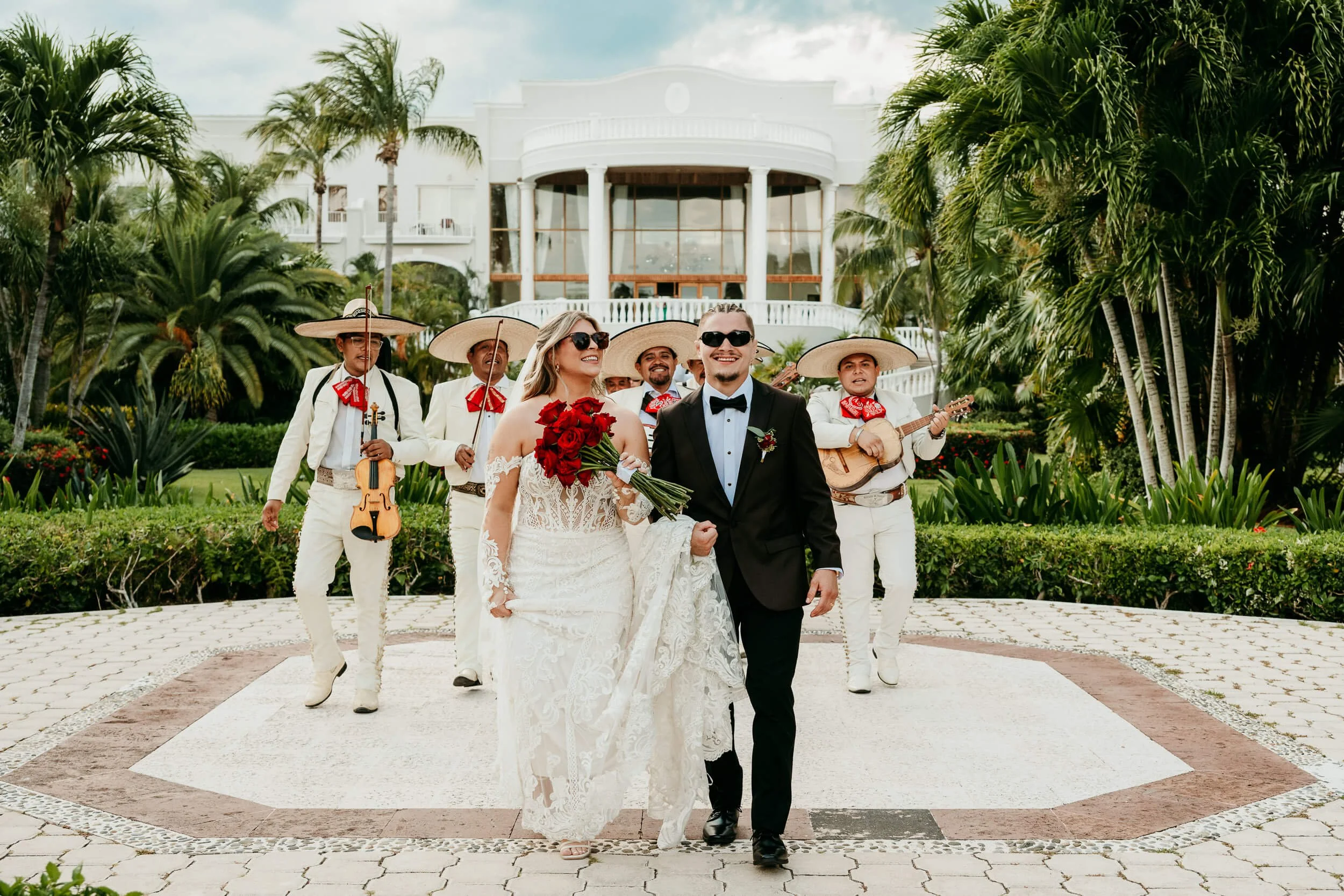 dreams-tulum-wedding-photographer-couple-leading-mariachis.jpg