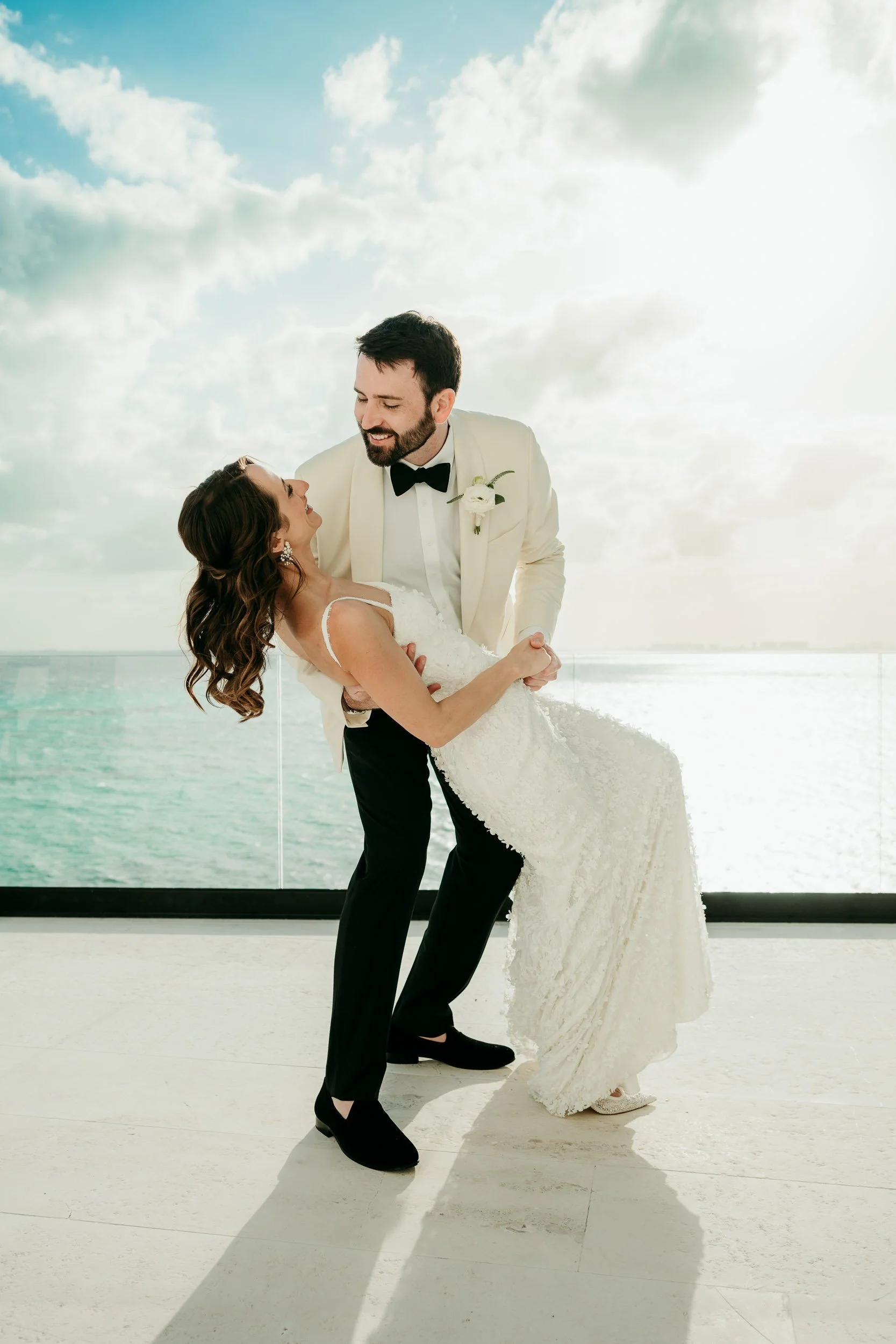 evolve-isla-mujeres-wedding-photographer-groom-dips-bride.jpg