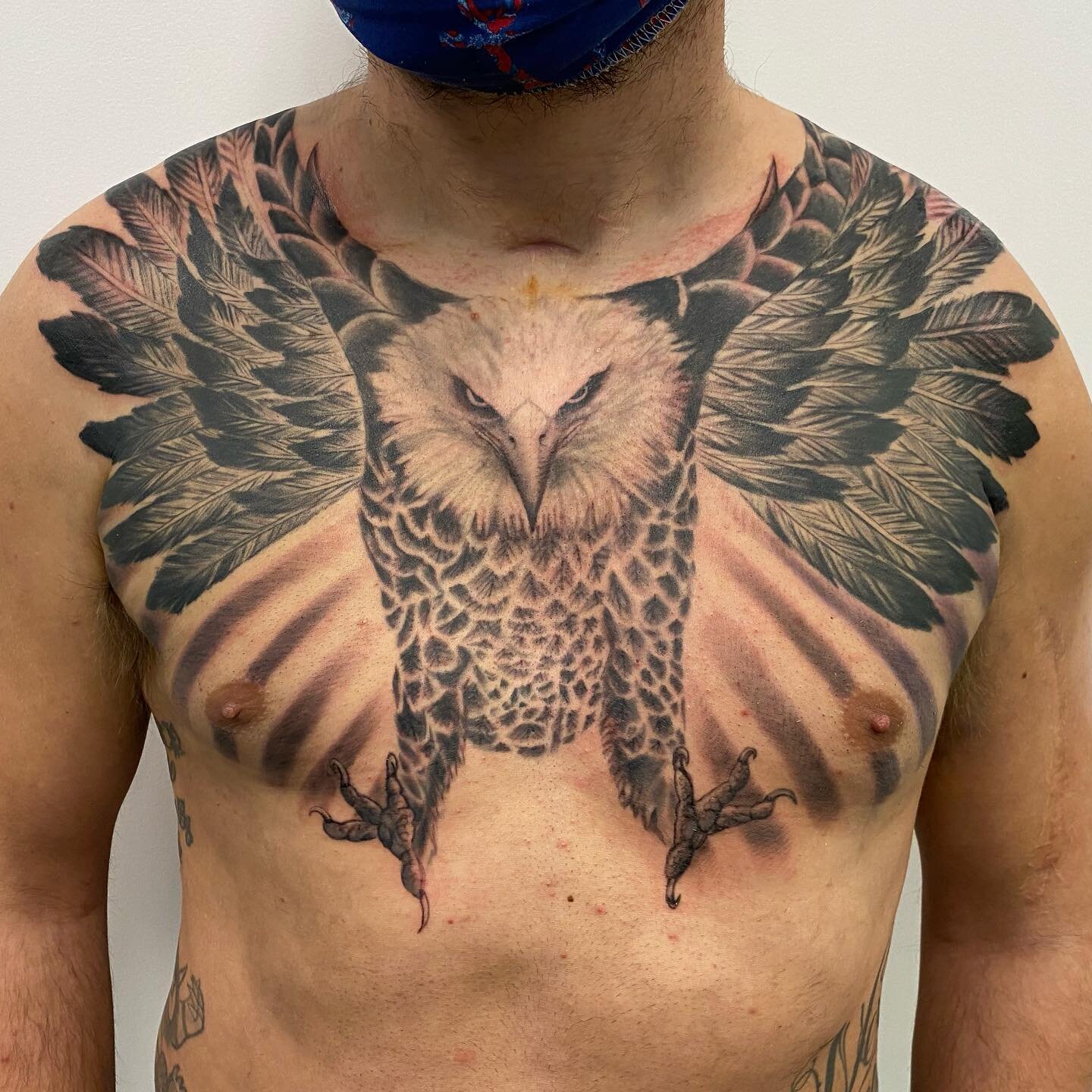 Work in progress on one of my closest friends. That means I push him through this torture by shit talking his pain tolerance. Got him through a 7 hour first session. The rays are from the second session which shows the healed head and feathers from t