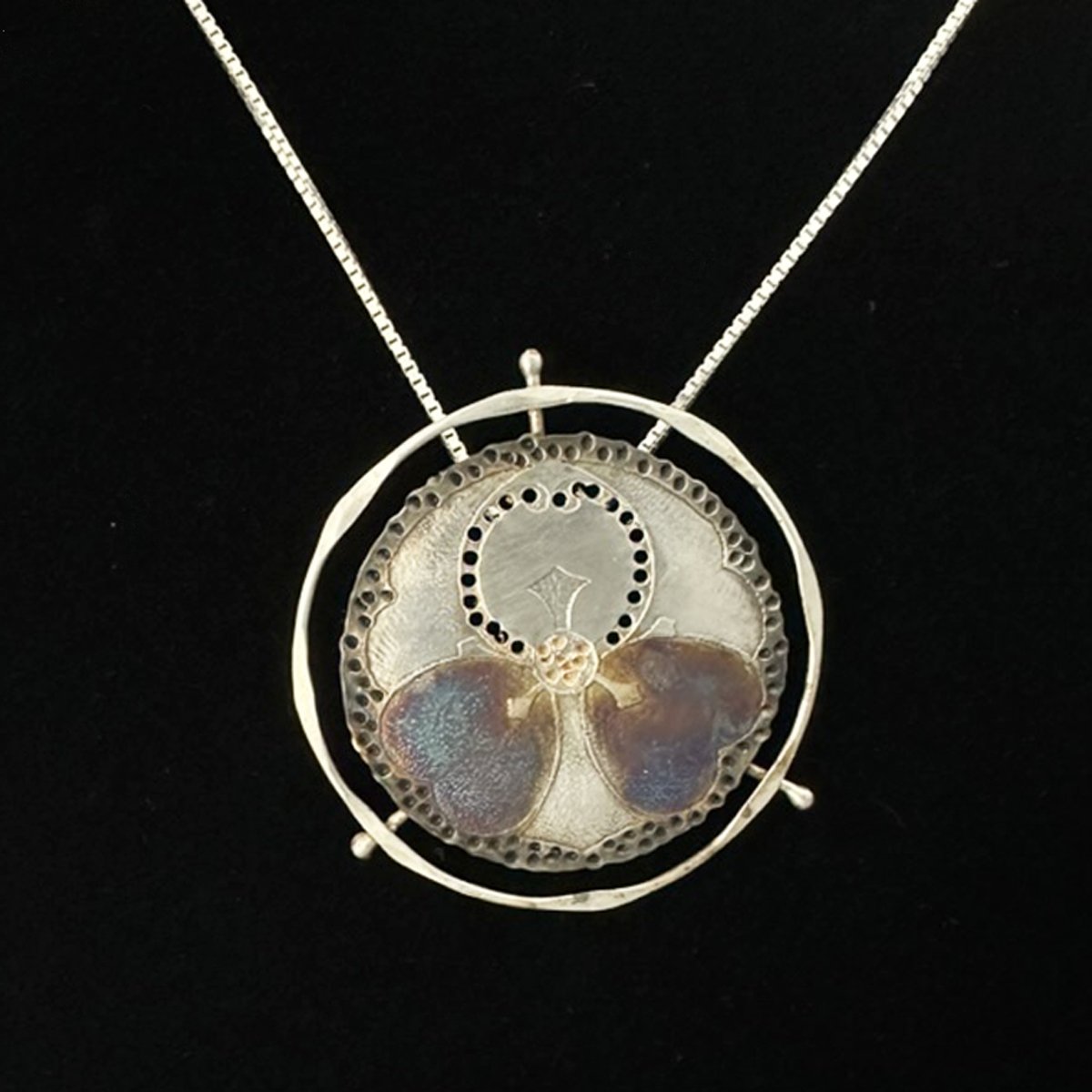 Double hearts on circle pendant.jpg