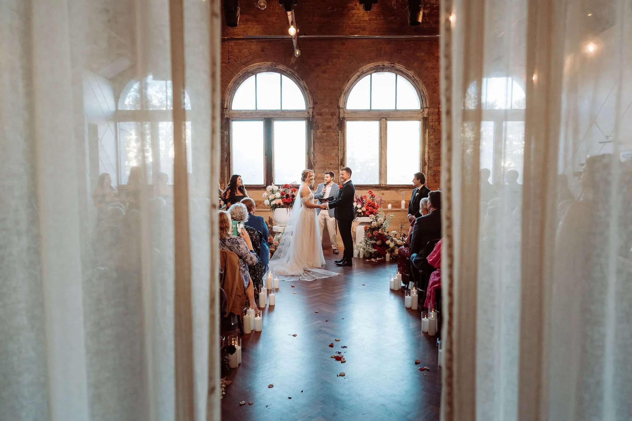 Male Celebrant marrying couple at Brisbane wedding venue - The Warehouse