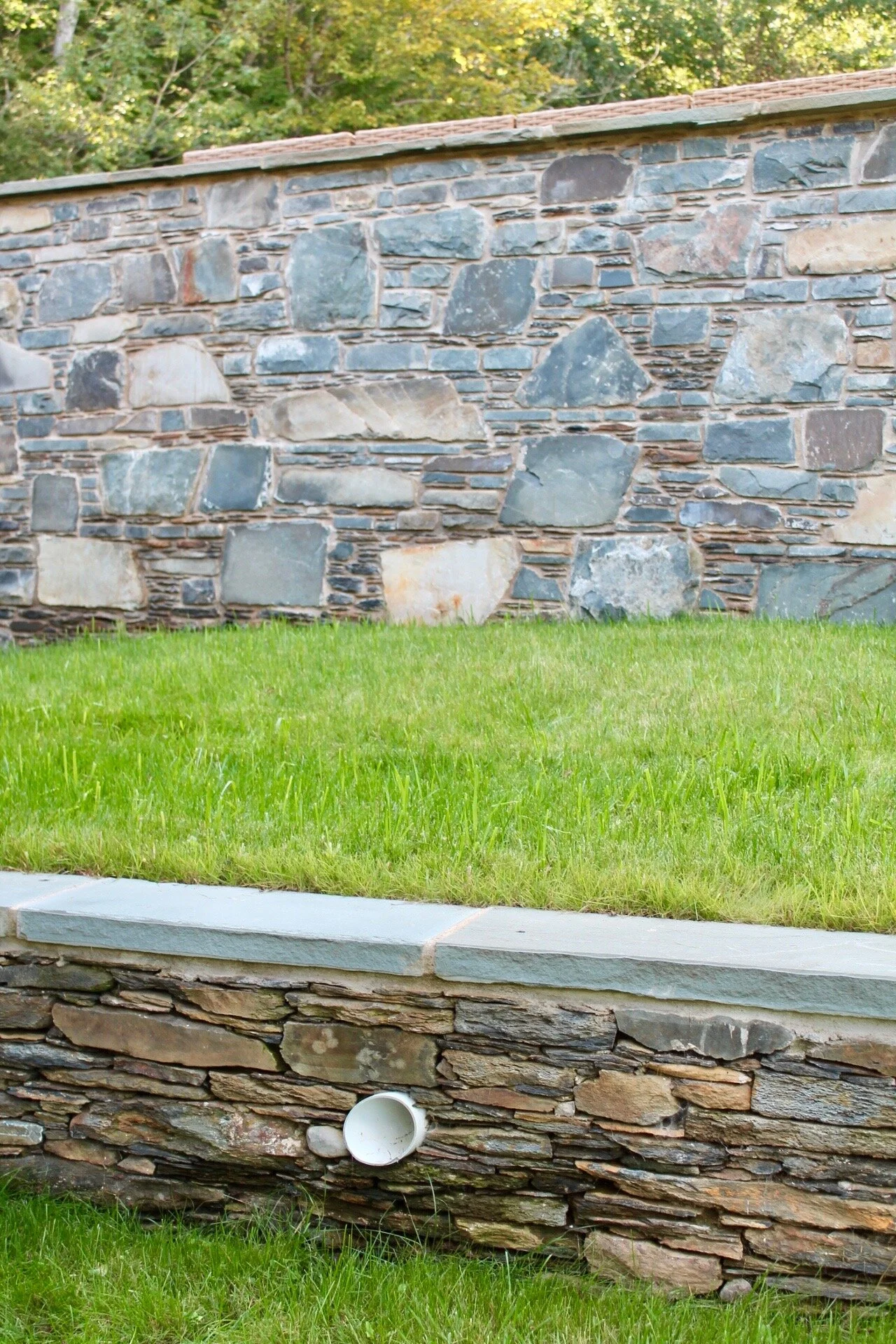 Two tier retaining wall in bluestone ironstone slate