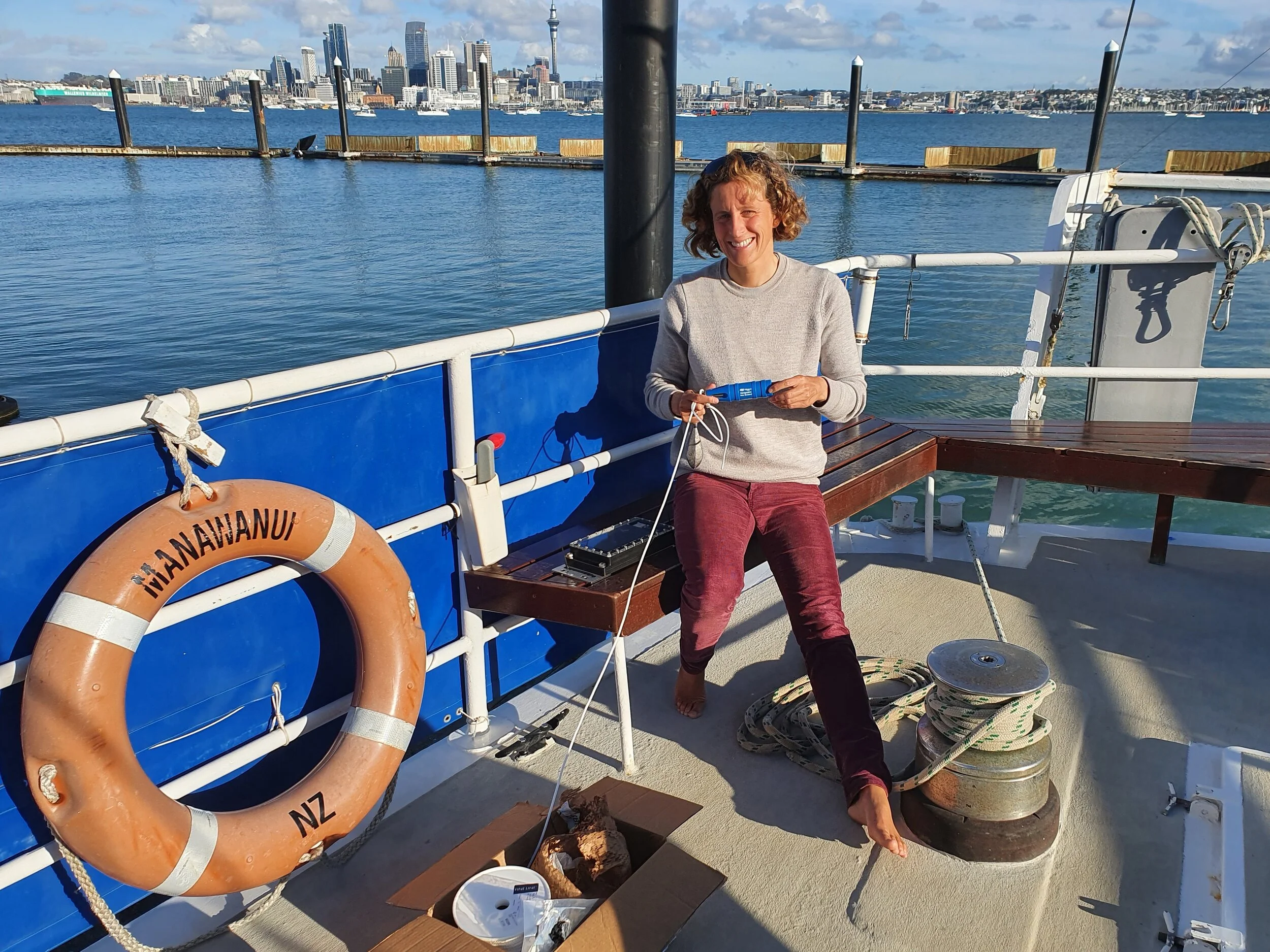 Dr Julie Jakoboski aboard the S/V Manawanui in Auckland, attaching the Mangōpare sensor