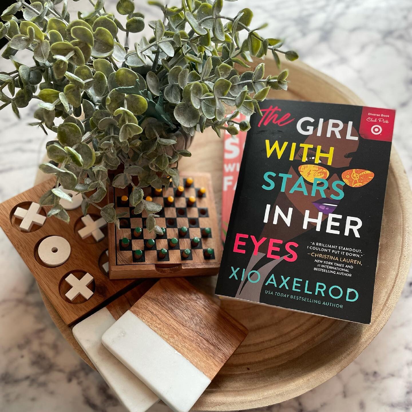 We&rsquo;re going on a little road trip for the 4th and I can&rsquo;t wait to start reading The Girl With Stars In Her Eyes by @xioaxelrod!!! The cover is beyond beautiful, but it was this line &ldquo;strong, feminist, and fierce as fire&rdquo; that 