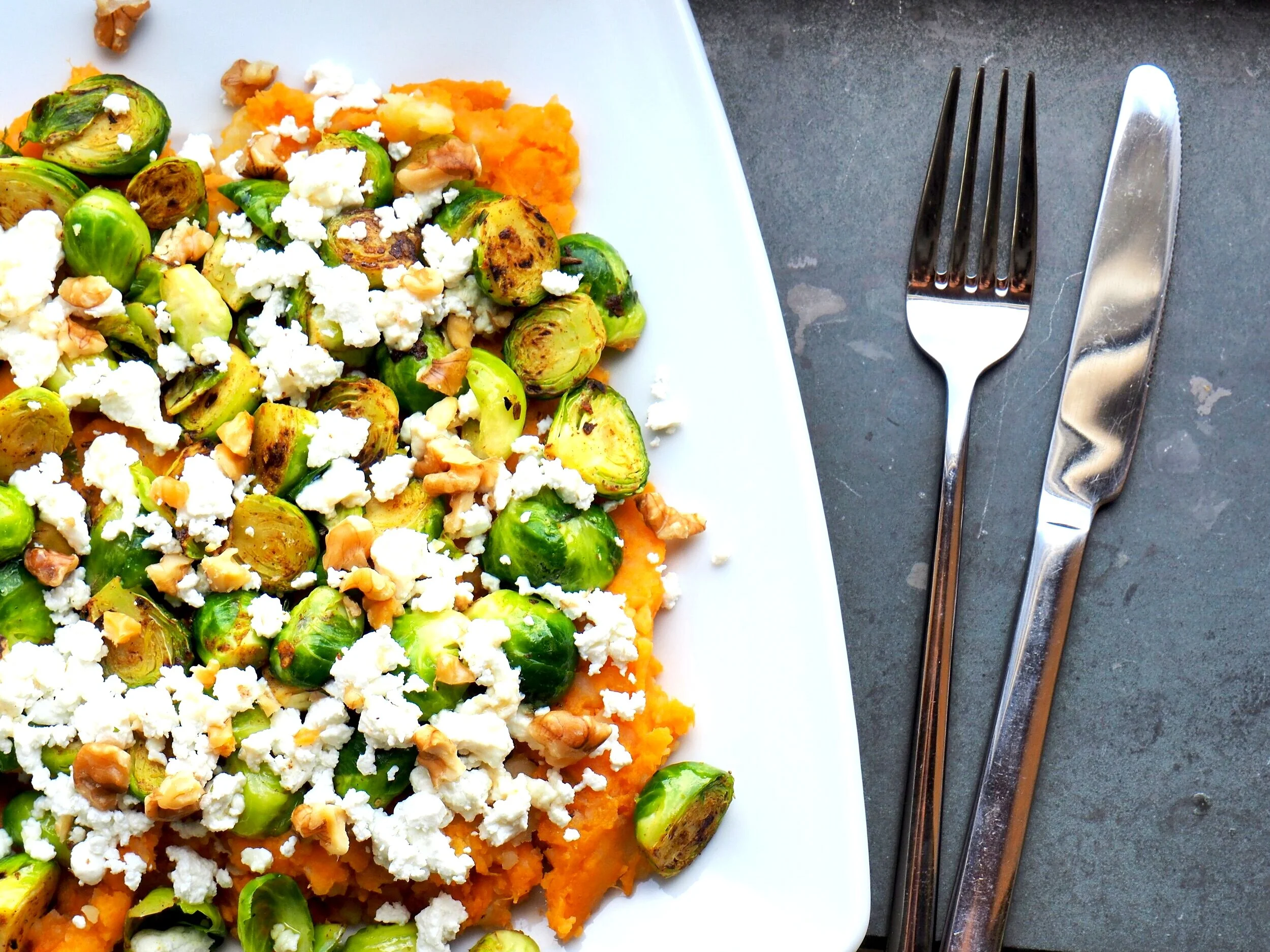 Brussels Sprouts & Sweet Potatoes with Walnuts and Goat Cheese