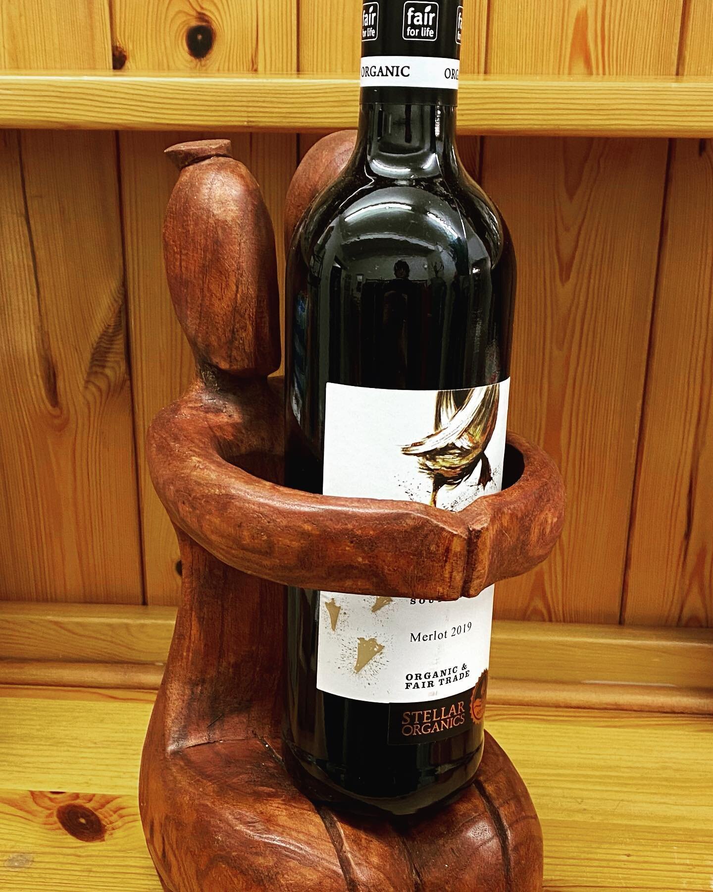 A hand carved sustainable wood wine bottle holder, a real talking point. Wine not included, but do see our range of fairtrade wines too! #handcarved  #sustainablewood #winebottleholder #fairtradewine