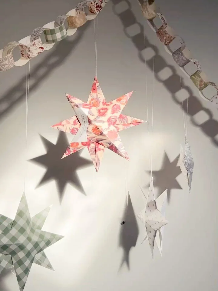 Paper stars giving extra whimsy to the studio &amp; a smattering of other cozy Christmas moments.

I followed @rileysheehey&rsquo;s tutorial for the stars! They are so relaxing &amp; charming ✨