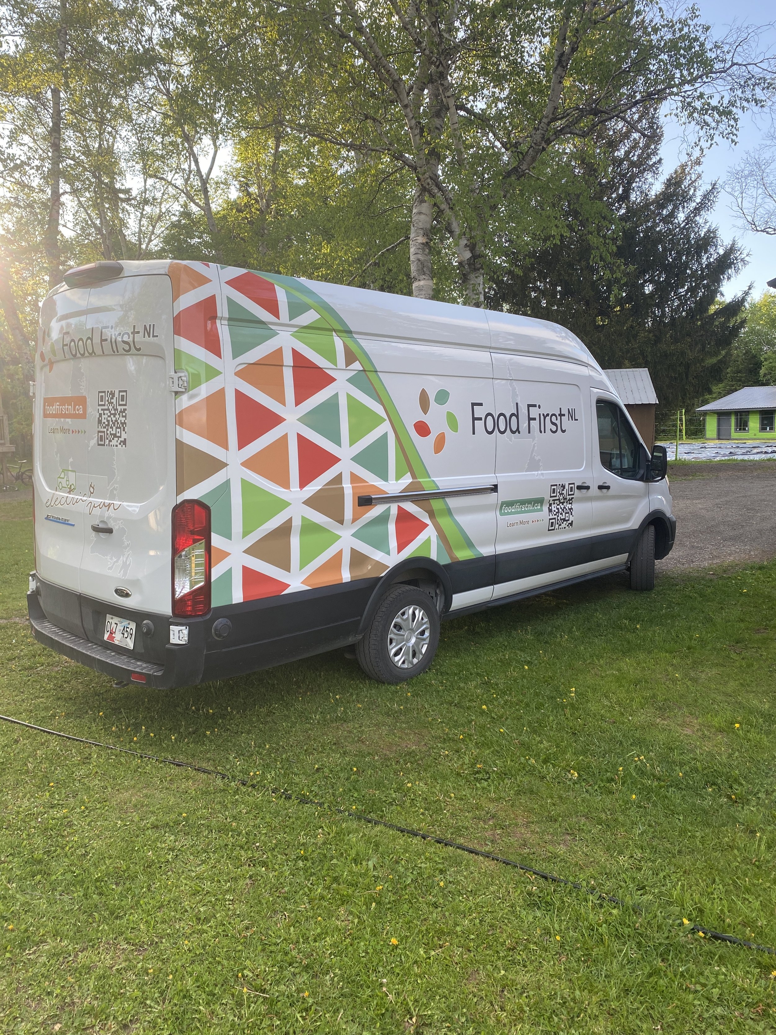 A back-on view of the Western Food Hub with its colourful wrap and Food First NL logo applied.