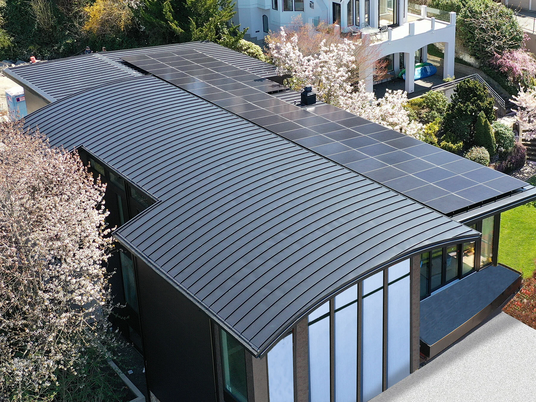 All-black solar panels installed on modern home; installed by Northwest Electric & Solar