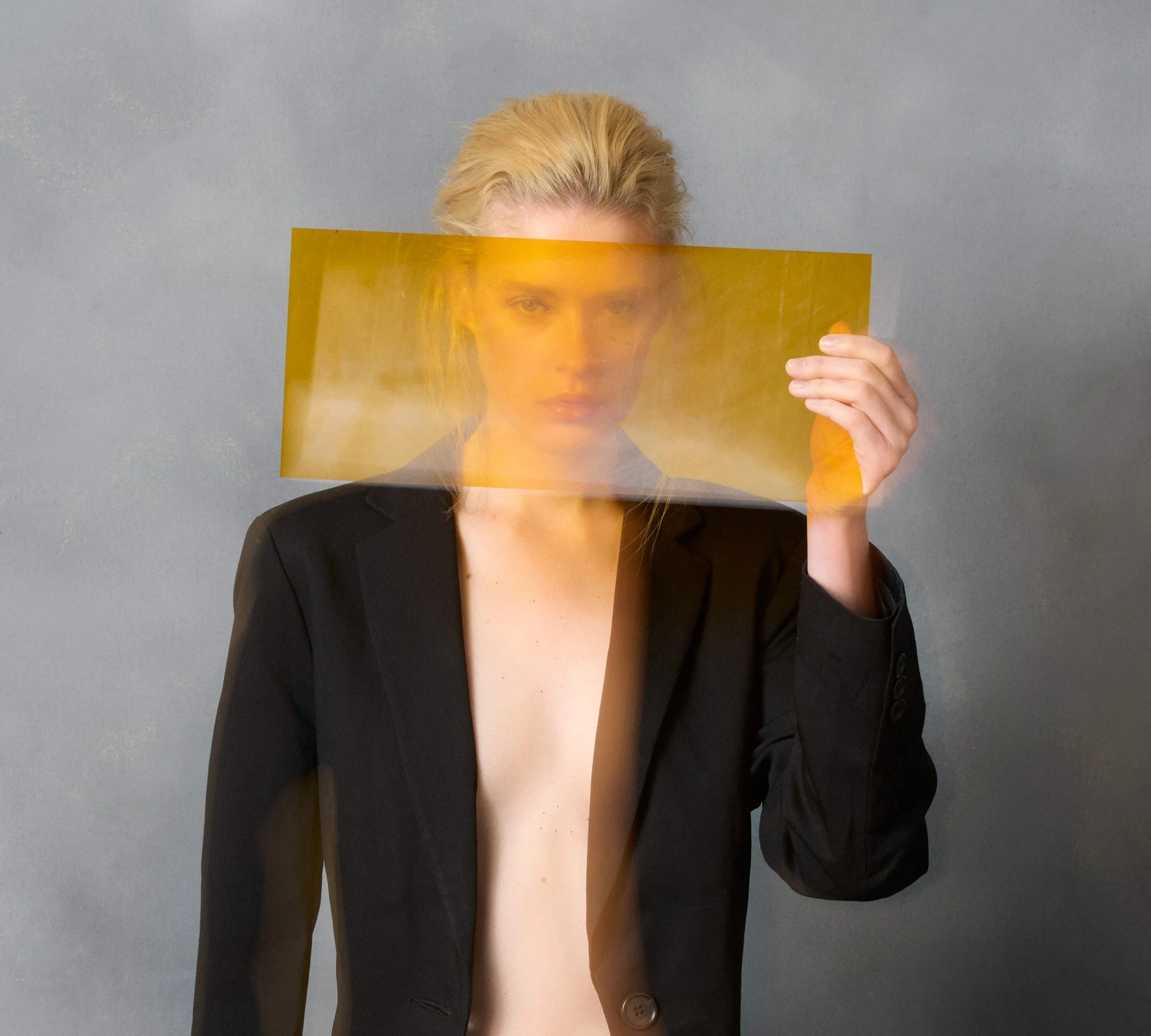 Portrait of Sydney model Bianca Hepburn with orange perspex. Photographer David.A.Knight ©