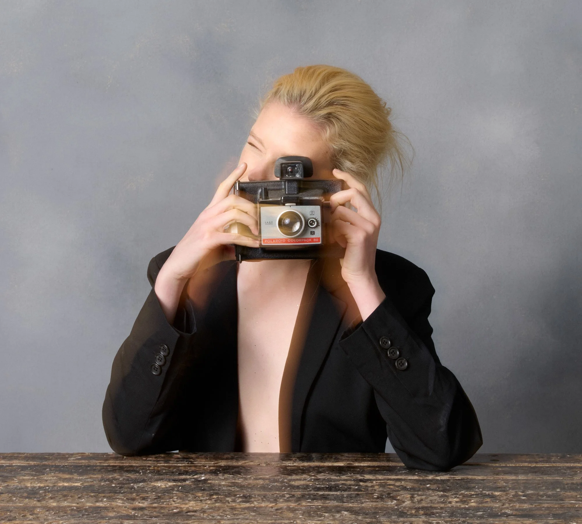 Portrait of Sydney model Bianca Hepburn with polaroid camera By ©David.A.Knight