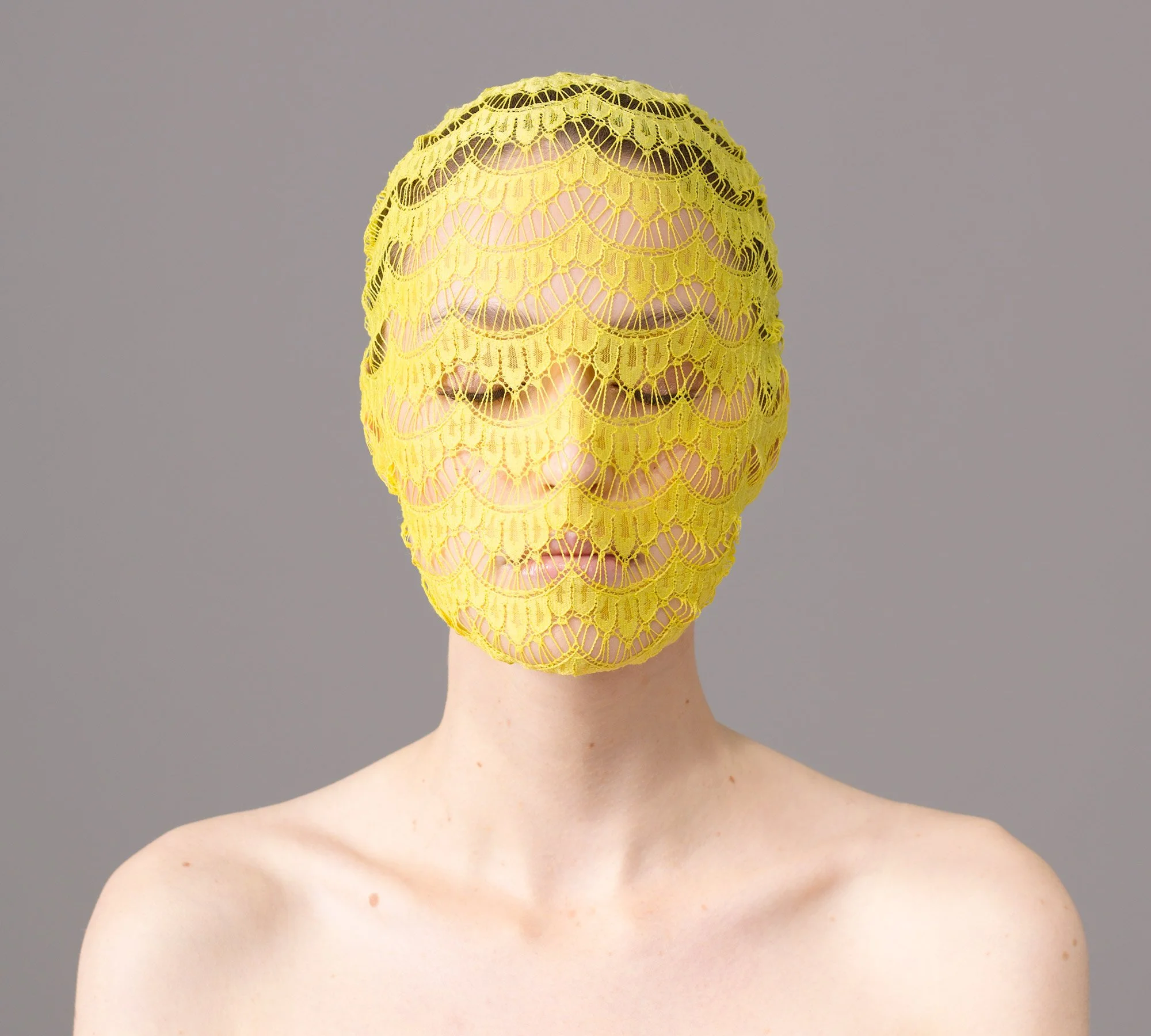 Studio portrait of Chloe with yellow veil from the series 'Curiosity' by photographer David.A.Knight ©