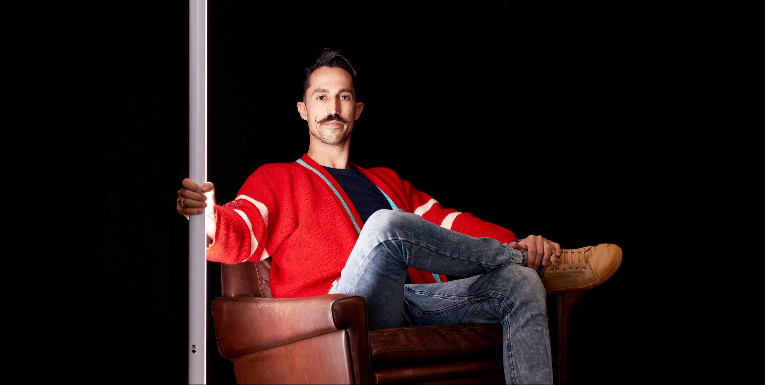 Studio portrait of lighting supervisor Francesco Sansori with light stick by photographer David.A.Knight ©