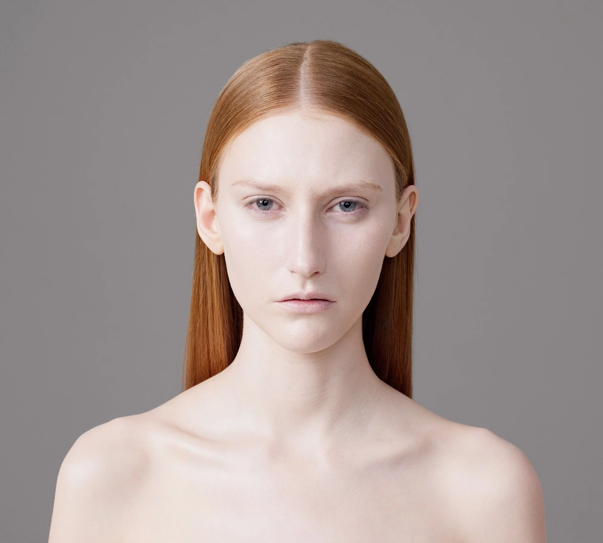 Studio portrait of Lauren with intense gaze to camera from the series 'Curiosity' by photographer David.A.Knight ©