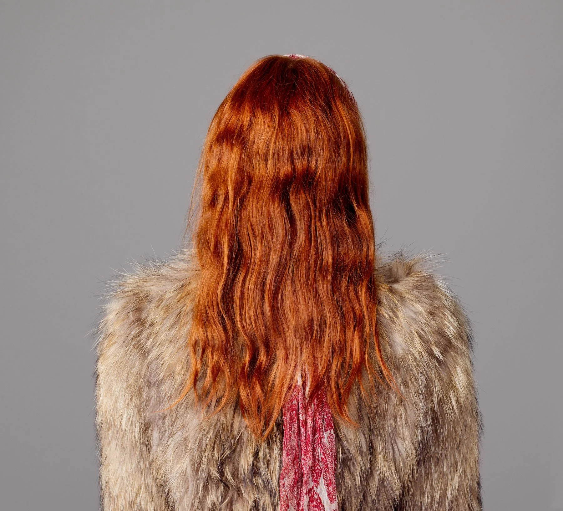 Back view portrait of German fashion model Eilika Meckbach with faux fur coat, red head scarf and flaming red hair by Sydney photographer David.A.Knight ©