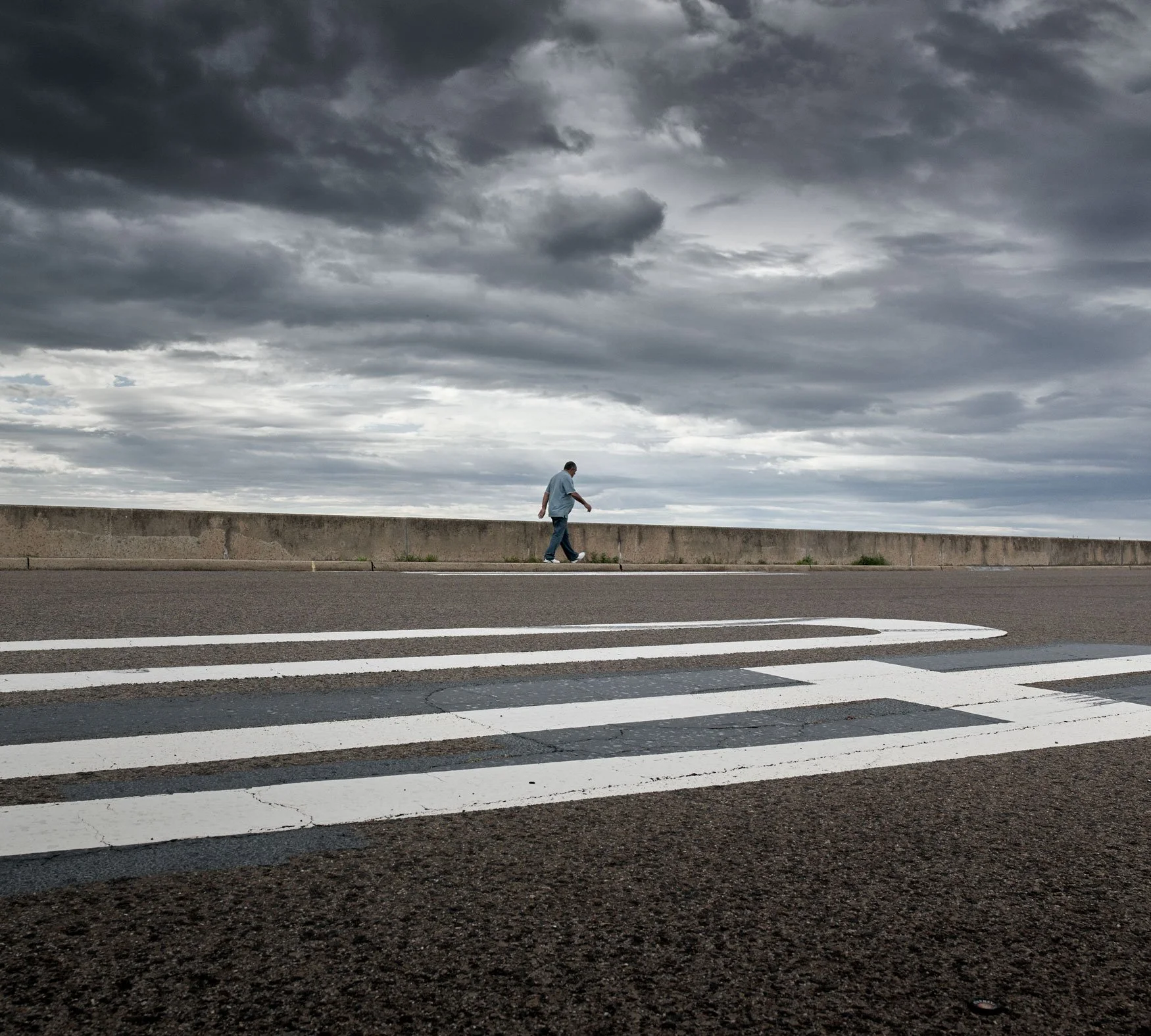 Solitary man walking at Prince Henry Drive Sydney by photographer David.A.Knight. The image was a Semi-Finalist in the Moran Contemporary Photography Prize.