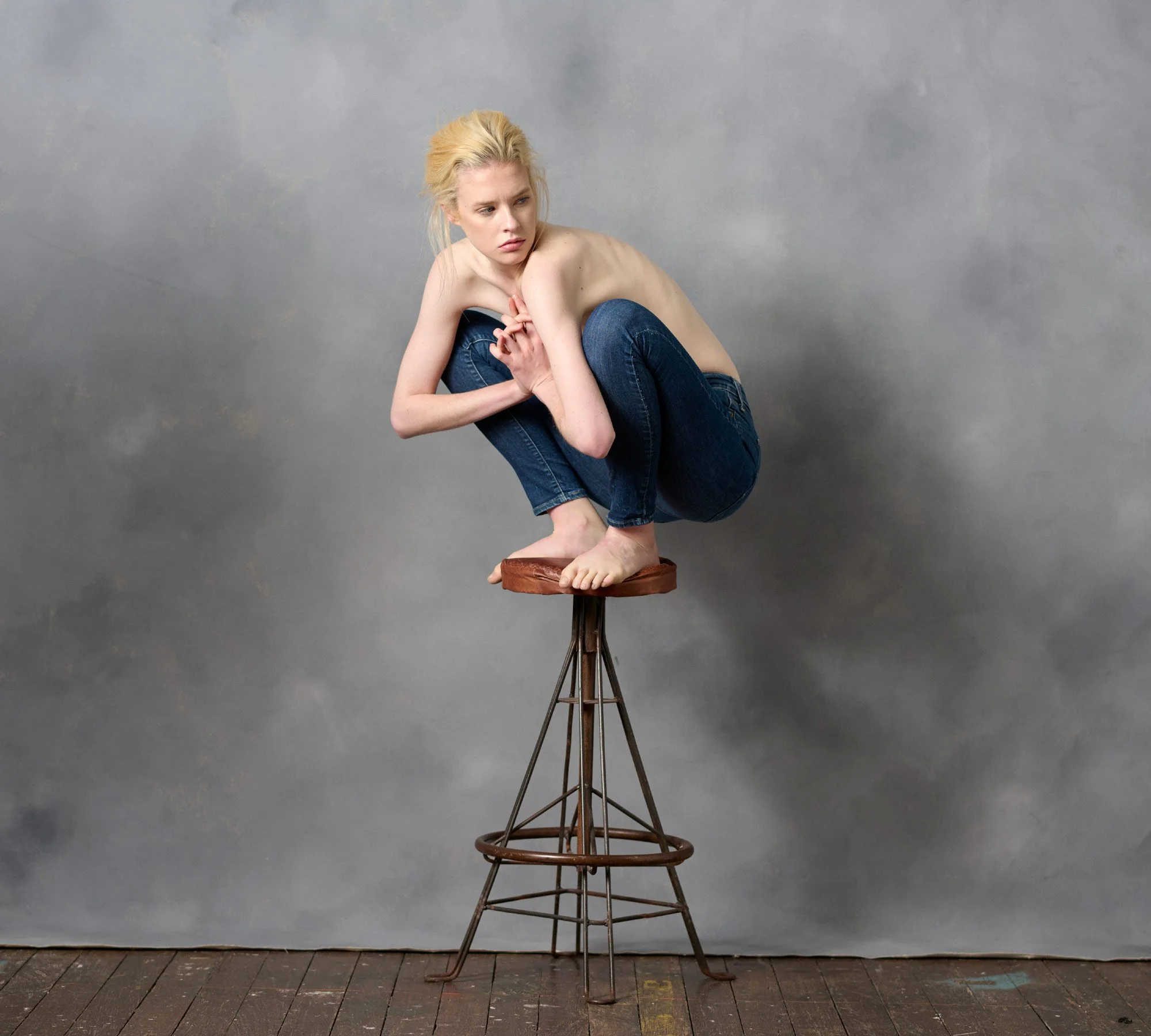 Portrait of Sydney model Bianca Hepburn perched on a stool. Photographer David.A.Knight ©