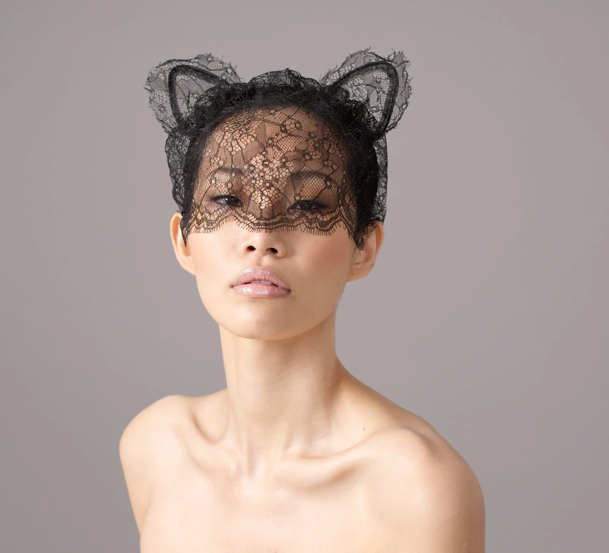 Studio portrait of Kat with lace mask from the series 'Curiosity' by photographer David.A.Knight ©