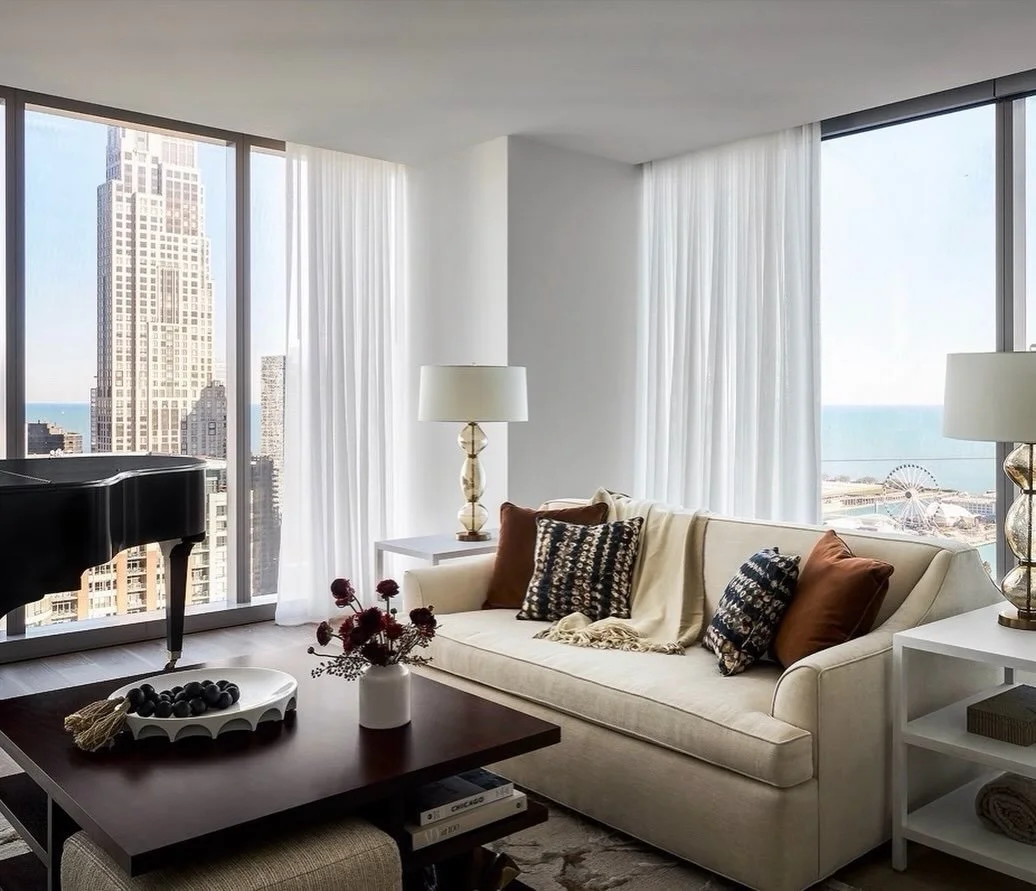 Above the winter chill ❄️&mdash;this is our favorite way to see Chicago! A warm interior retreat, floor-to-ceiling windows, and a custom two-sided sofa made for front-row views of both the skyline and Lake Michigan. The coziest way to take it all in.