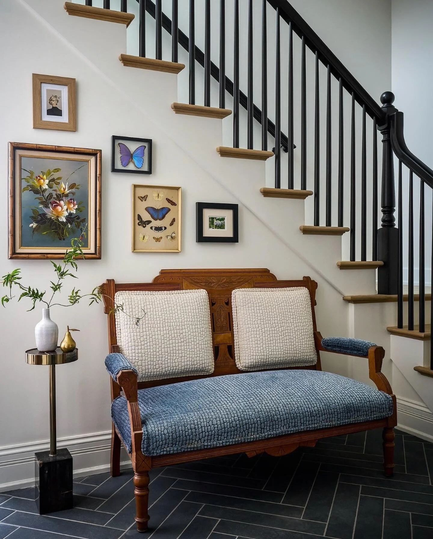 A home that tells your story. 🦋 This foyer captures the essence of a truly collected space, where cherished art and thoughtfully updated antiques come together in a layered, timeless way. Each piece holds meaning or reflects a memory, and together t