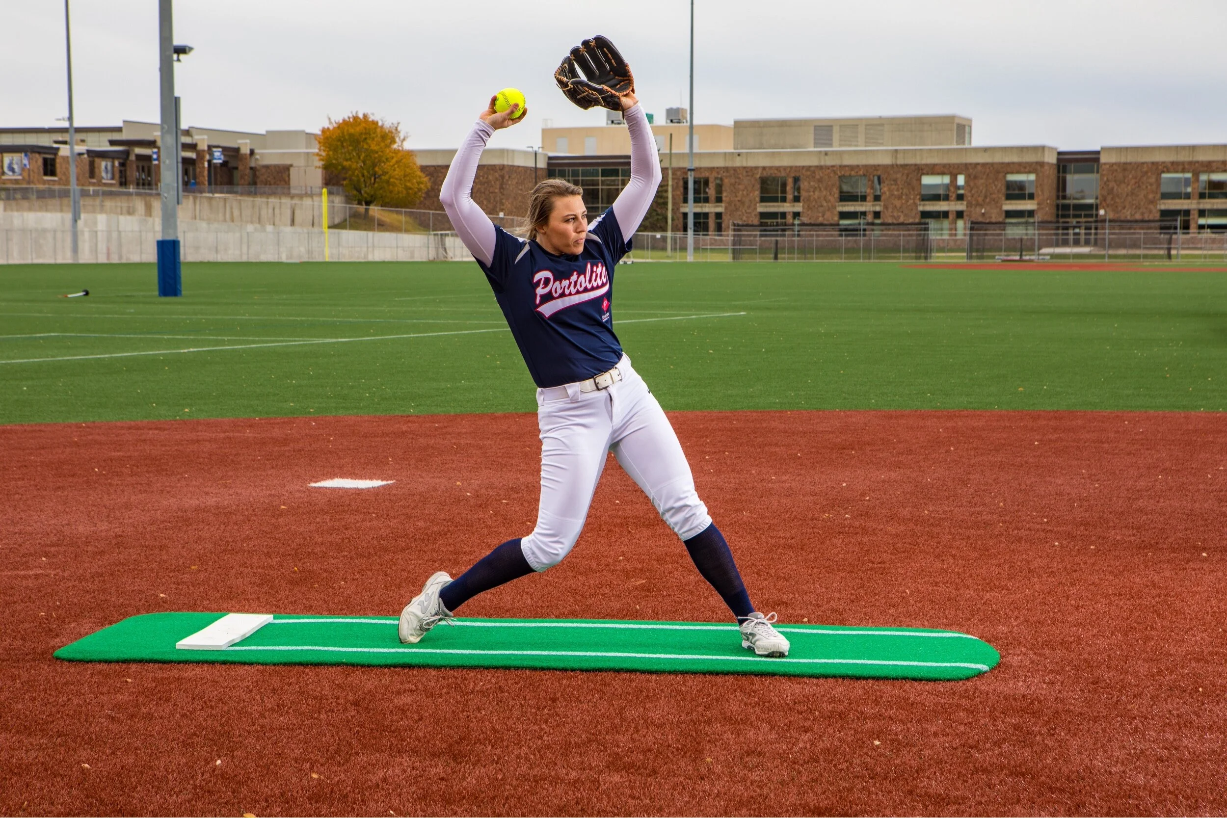 Portolite Softball Pitching Mats have 5,000 spikes and a stayput guarantee.