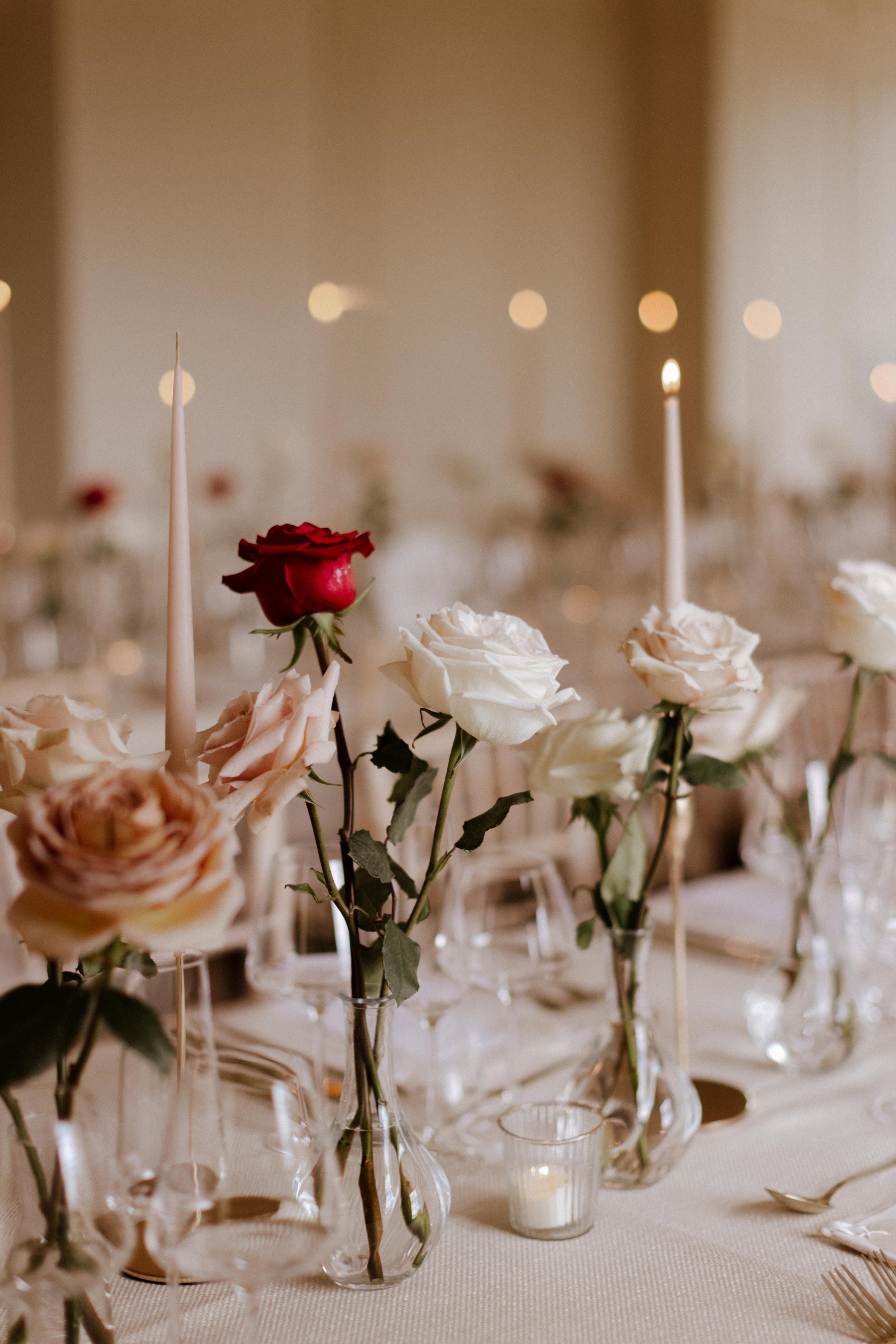 Long stem roses wedding table centres.jpg