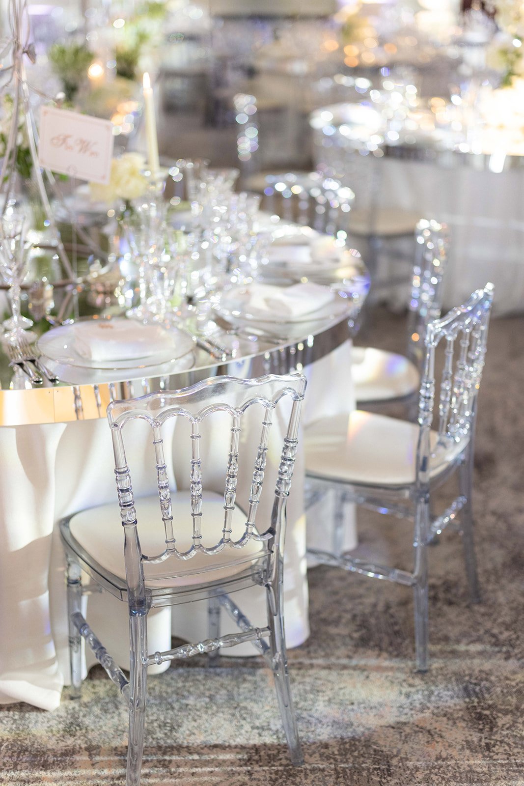 Round mirror table, clear ghost chair, Four Seasons Hampshire wedding.jpg