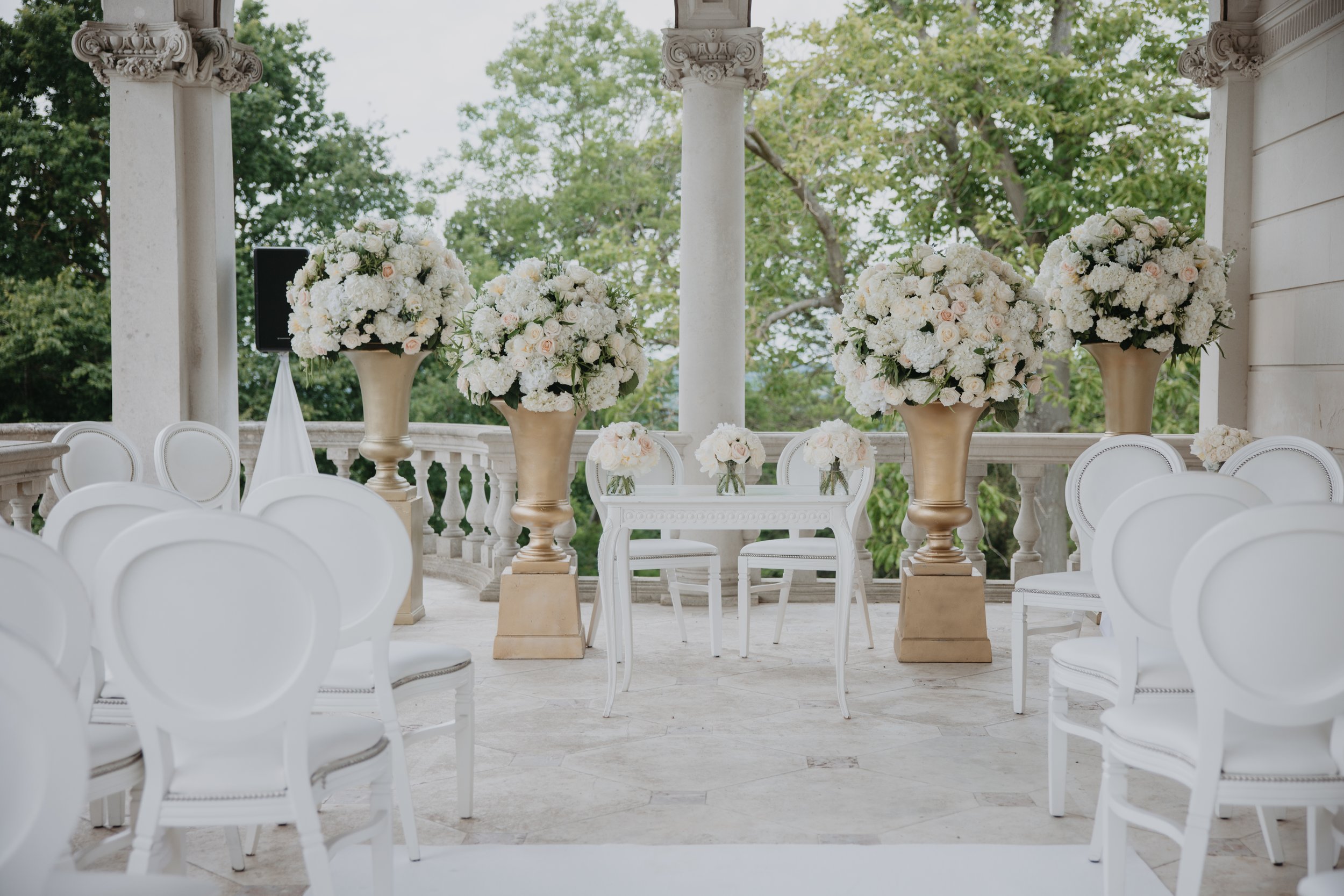 Cliveden wedding ceremony, white domes of flowers on golden pedestals.jpg