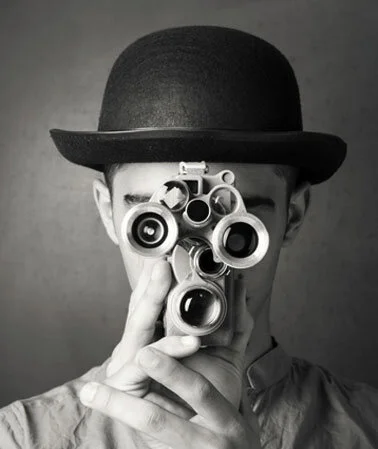 Two gamers holding controllers on a coach