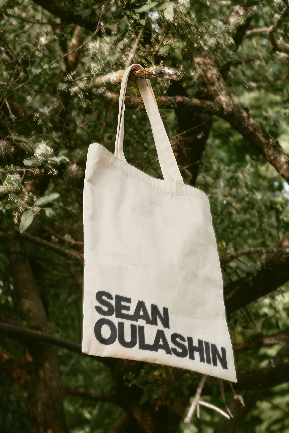 Wordmark applied to tote bag.