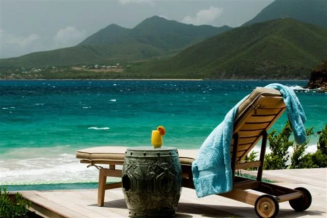 a lounger with a  view along the coast of St Kitts 