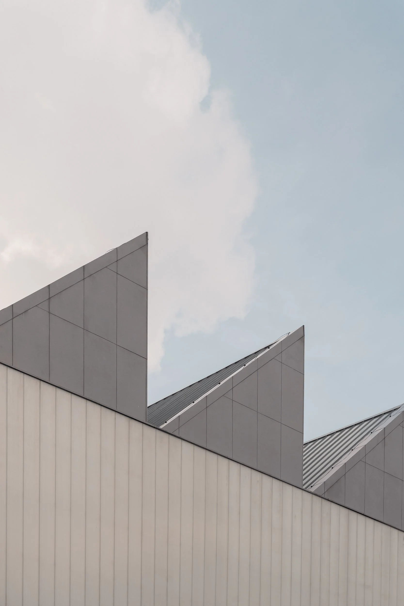 Exterior view of the serrated factory roof at Dib Bangkok