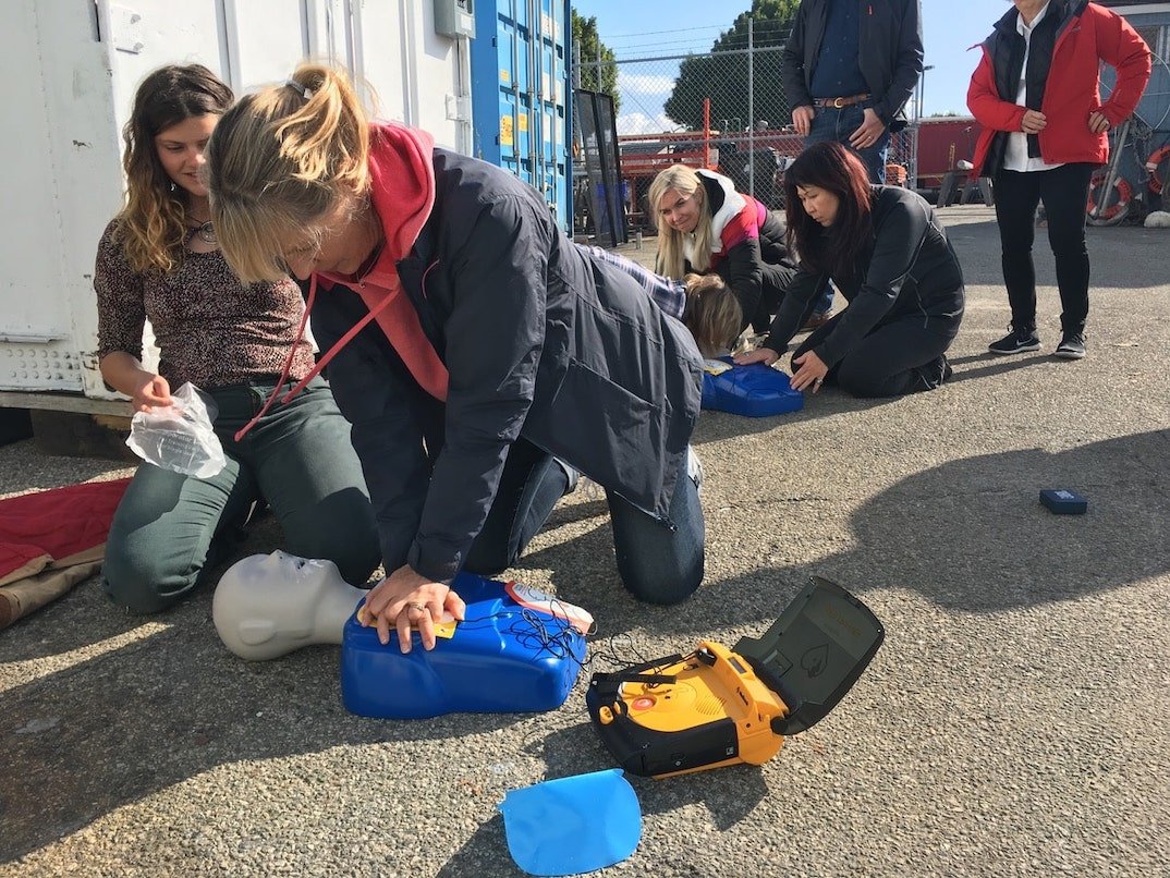   Maritime medicine students practicing CPR skills on mannequins.  